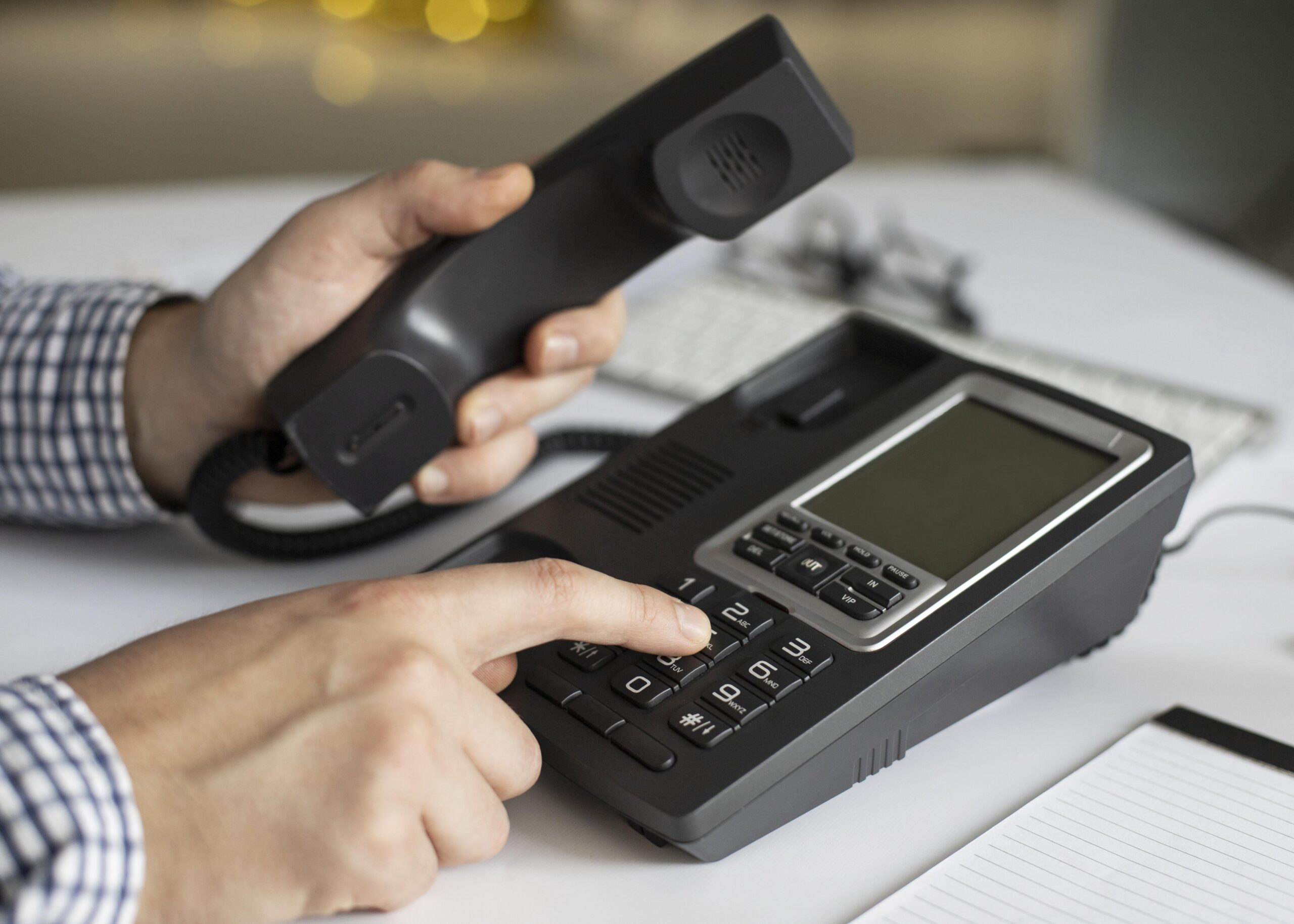 close-up-businessman-dialling-phone-number